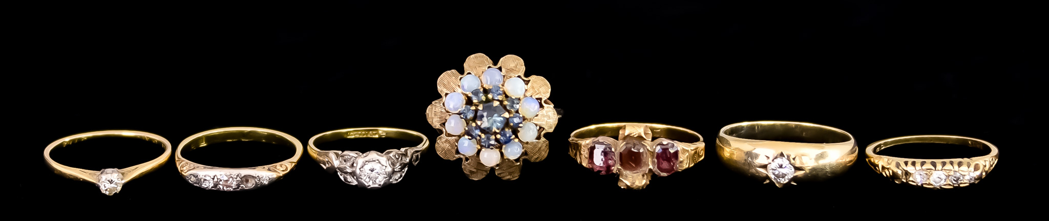 Seven 18ct Gold Gem Set Rings, comprising - gypsy ring set with a brilliant cut white diamond,