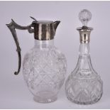 A Late Victorian Silver Mounted and Cut Glass Claret Jug and a George V Silver Mounted Decanter, the