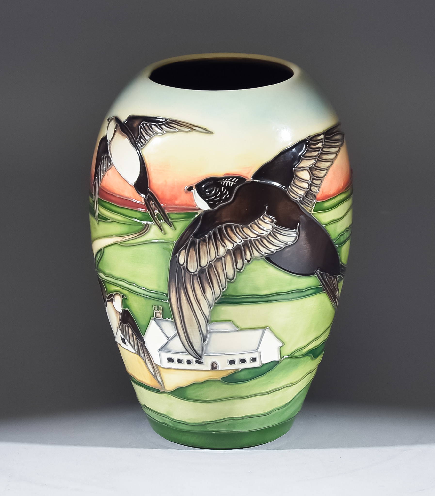 A Moorcroft Pottery Trial Vase, tube lined and decorated in colours with "Swift" design, possibly