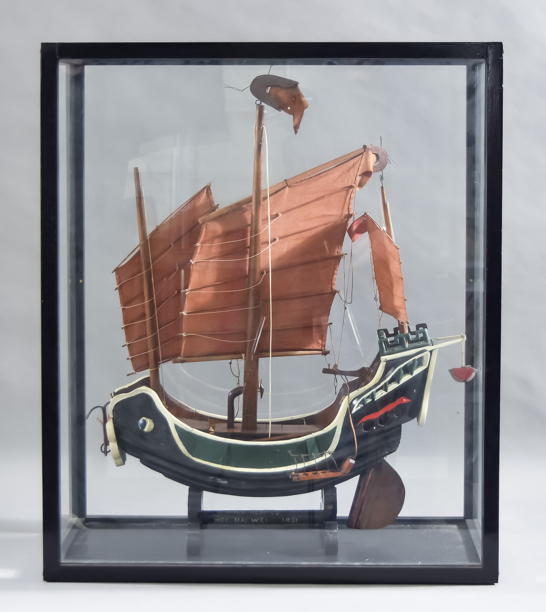 An Early 20th Century Painted Wood Model of a Junk, Circa 1931, 19ins wide x 22ins high, on shaped