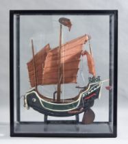 An Early 20th Century Painted Wood Model of a Junk, Circa 1931, 19ins wide x 22ins high, on shaped