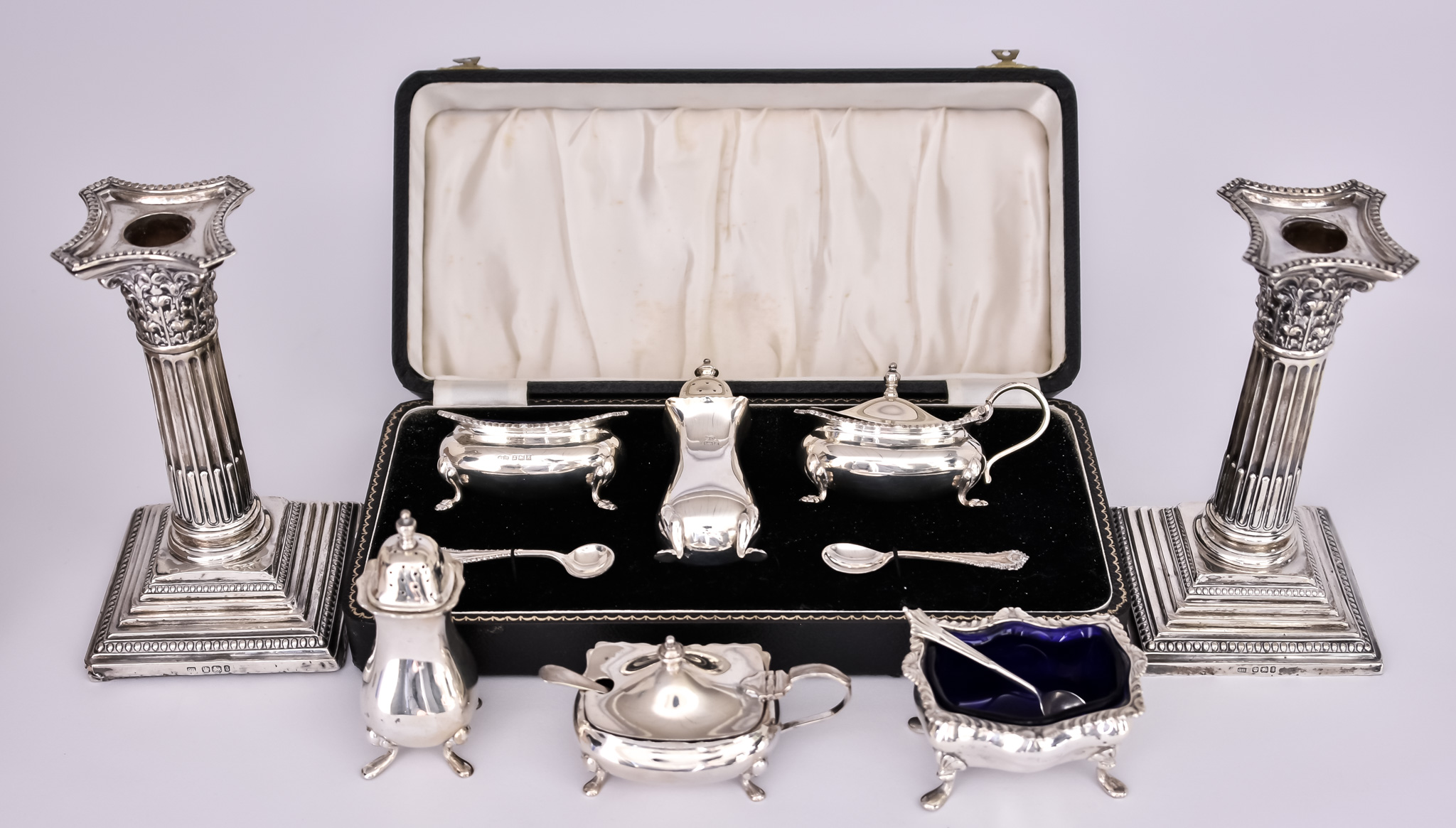 An Elizabeth II Three-Piece Condiment Set and Mixed Silverware, the condiment set by William