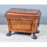 A George IV Panelled Mahogany and Ebonised Wine Cooler/Cellarette, of sarcophagus form, on carved