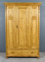 A Late 19th Century Panelled Pine Cupboard, with moulded edge to top, fitted hanging rail,