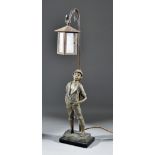 An Early 20th Century Spelter Table Lamp, modelled as a boy leaning against a lantern, 25ins high