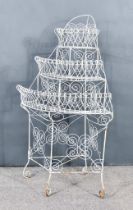 A White Painted Wire Work Metal Three Tier Bow Fronted Etagere, 30ins wide x 20ins deep x 49ins