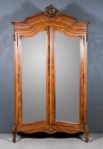 A Late 19th Century French Kingwood Armoire with moulded cornice and shell carved cresting, panelled