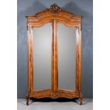 A Late 19th Century French Kingwood Armoire with moulded cornice and shell carved cresting, panelled