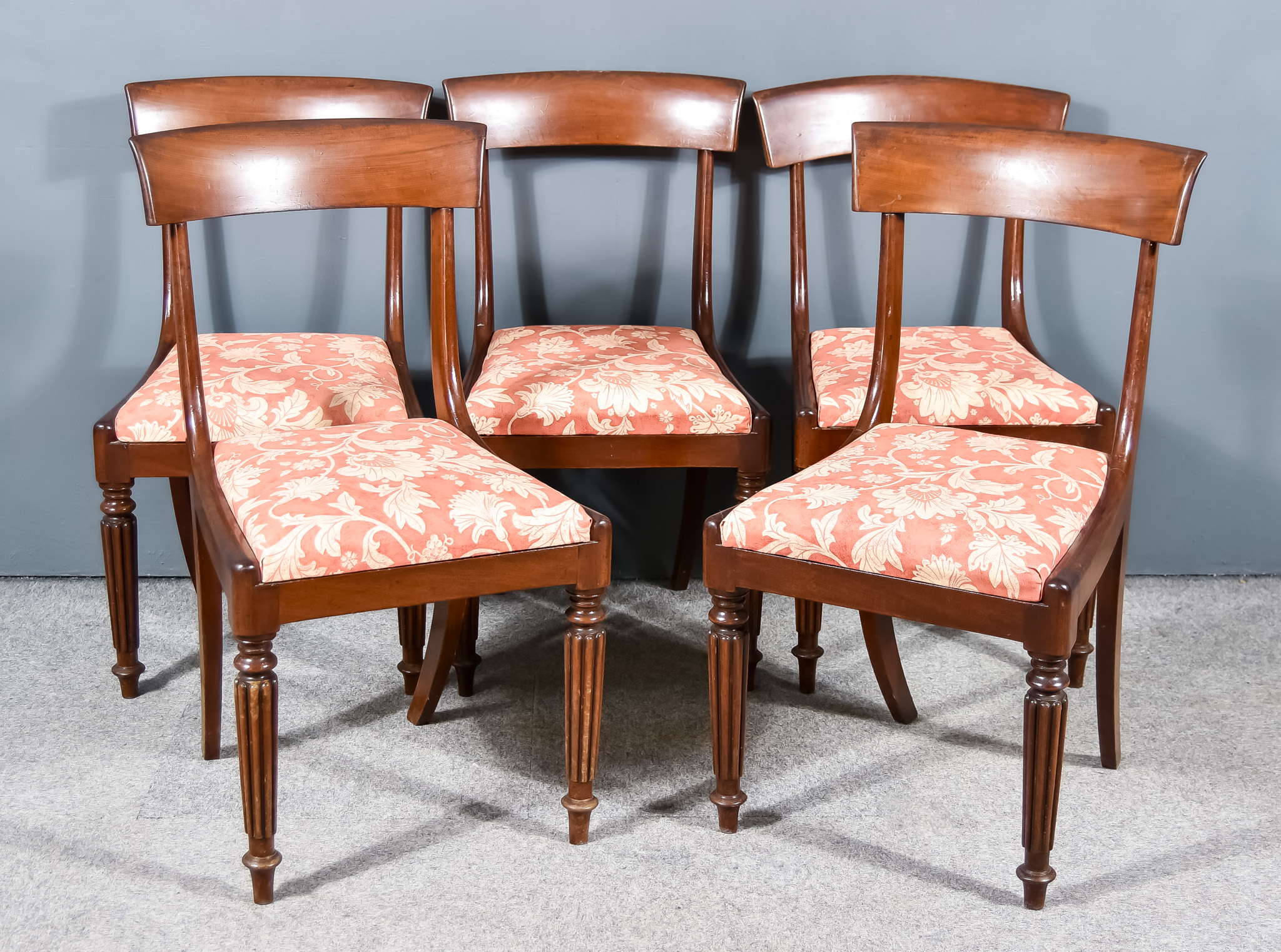 A Set of Five William IV Mahogany Dining Chairs, with wide plain curved crest rails, the drop-in