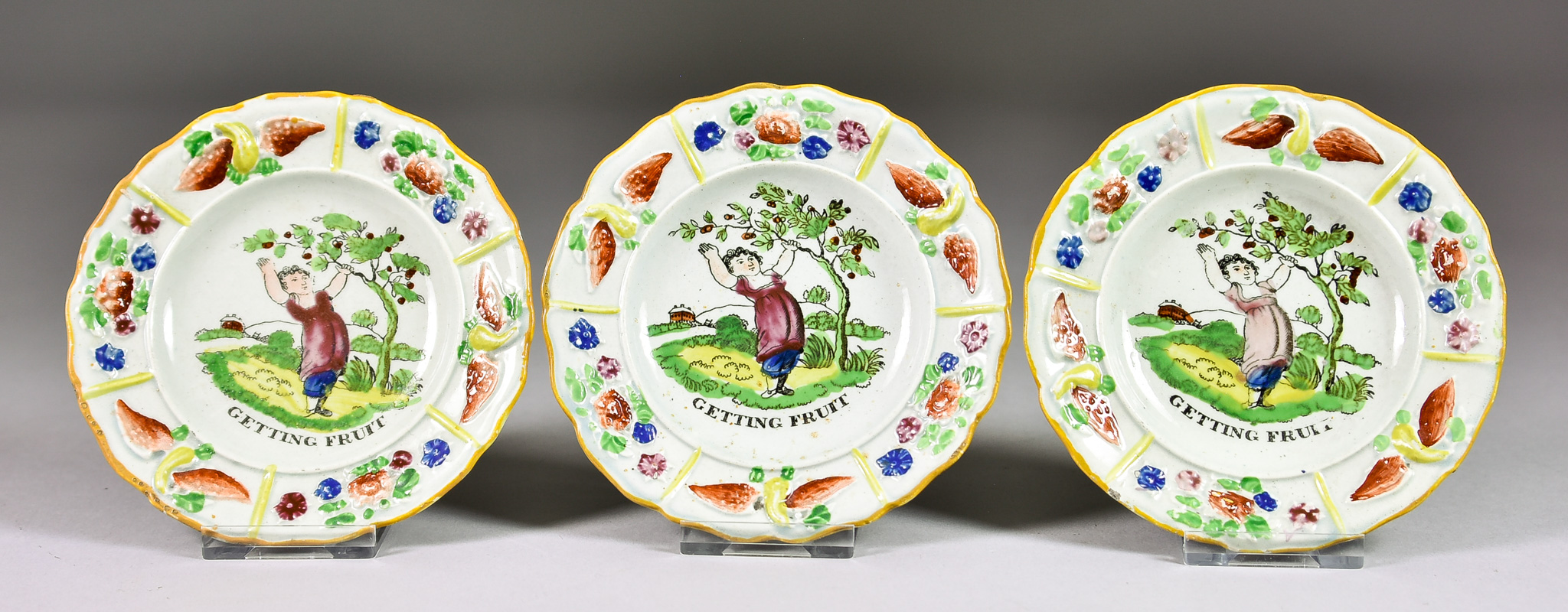 Three Moulded Pearlware Pottery Children's Plates, Circa 1830, the centres printed and painted