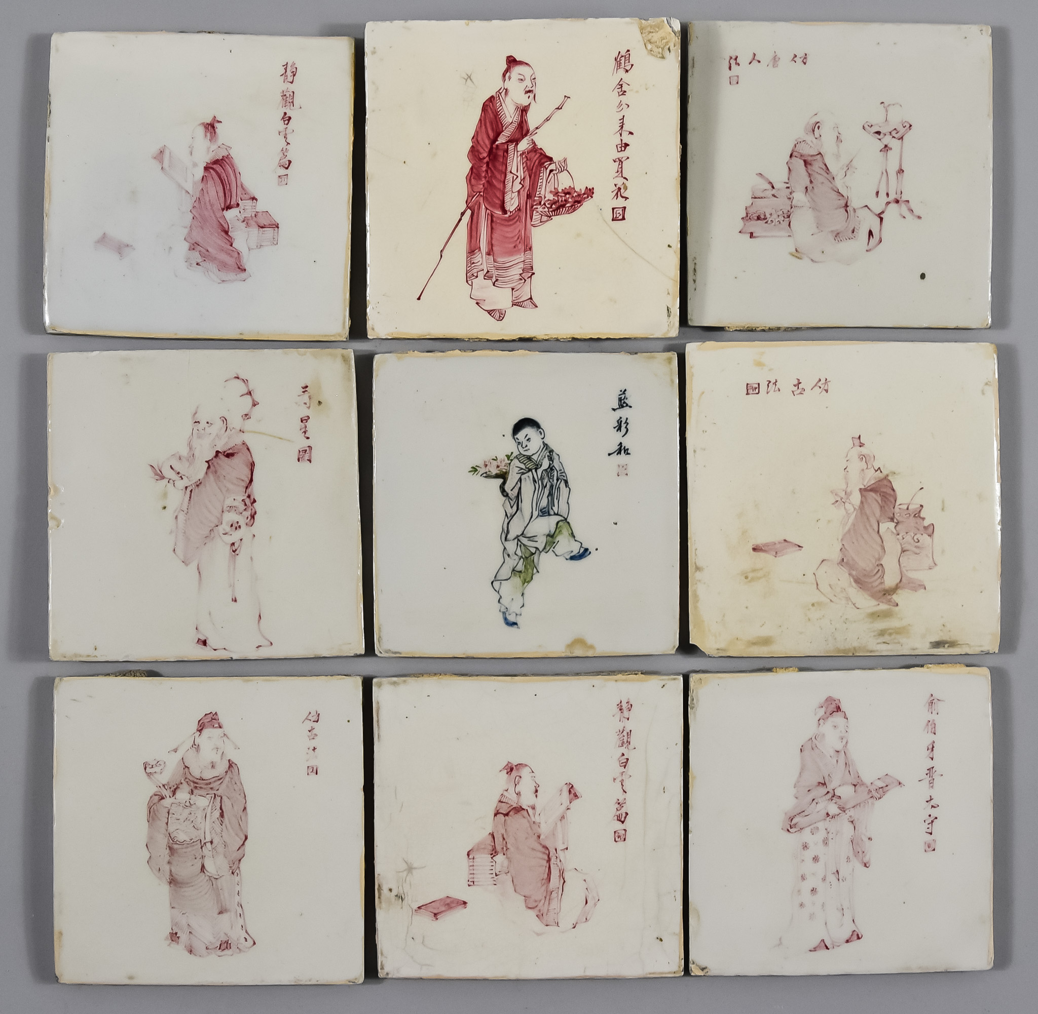 Eight Chinese Red Decorated Pottery Tiles, each with a single figure and script, Republic Period,