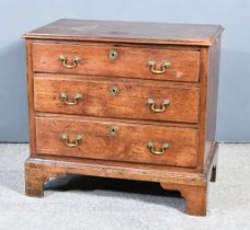 A George III Oak Chest of Drawers, with moulded edge to top, fitted three long graduated drawers, on