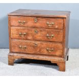 A George III Oak Chest of Drawers, with moulded edge to top, fitted three long graduated drawers, on