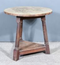 A 19th Century Oak Cricket Table, with four plank top, on turned supports, plain stretchers, on