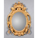 A 19th Century Gilt Framed Oval Girandole, with fretted scroll and floral frame, with two scroll