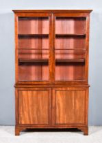 A 19th Century Mahogany Bookcase, the upper part with moulded cornice, fitted three shelves enclosed