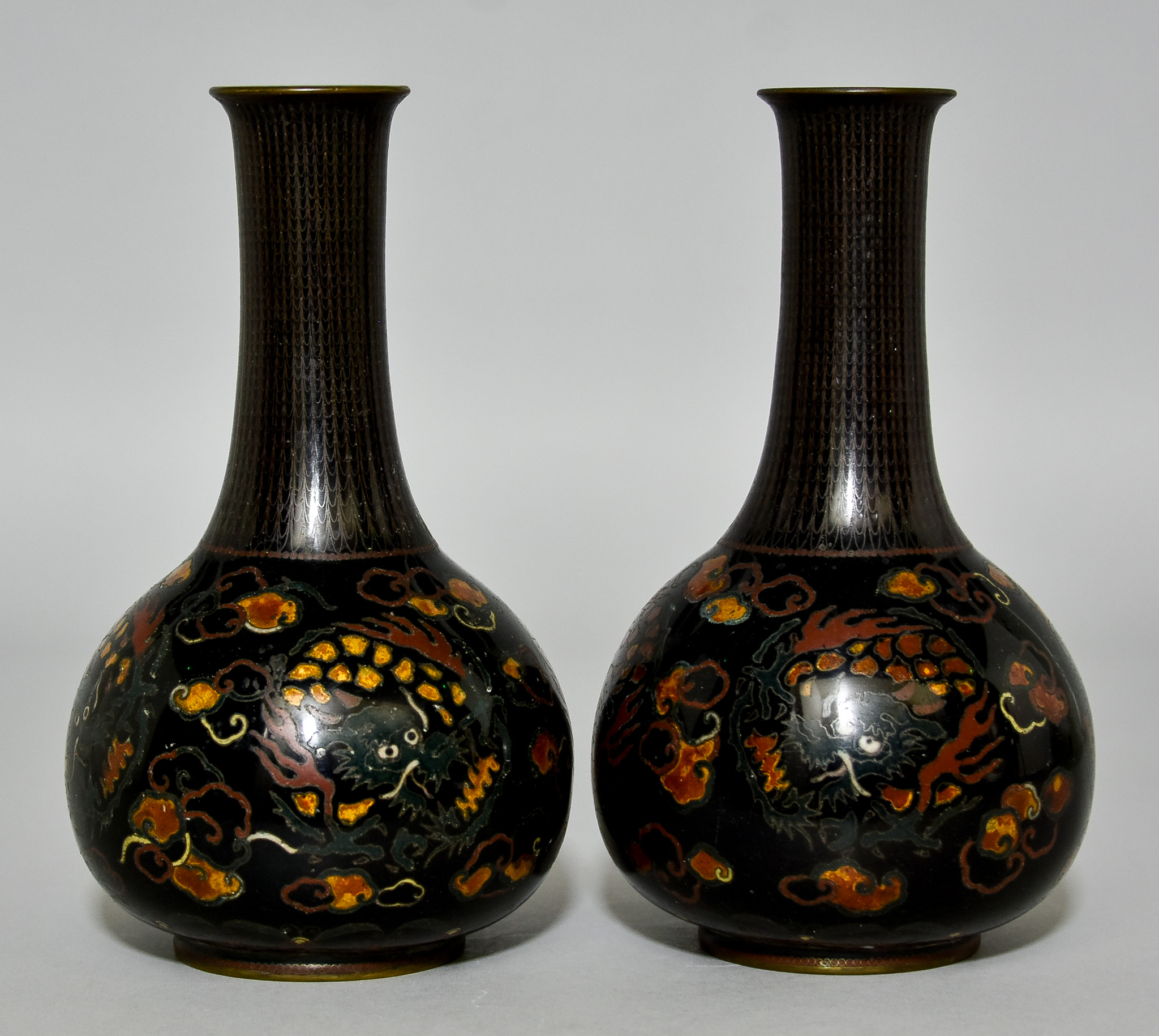 A Pair of Chinese Cloisonne Vases, 20th Century,  decorated in colours with dragons amongst