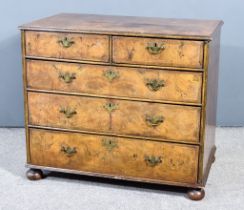 An Early 18th Century Figured Walnut Chest of Drawers, with moulded edge and cross-banding to the