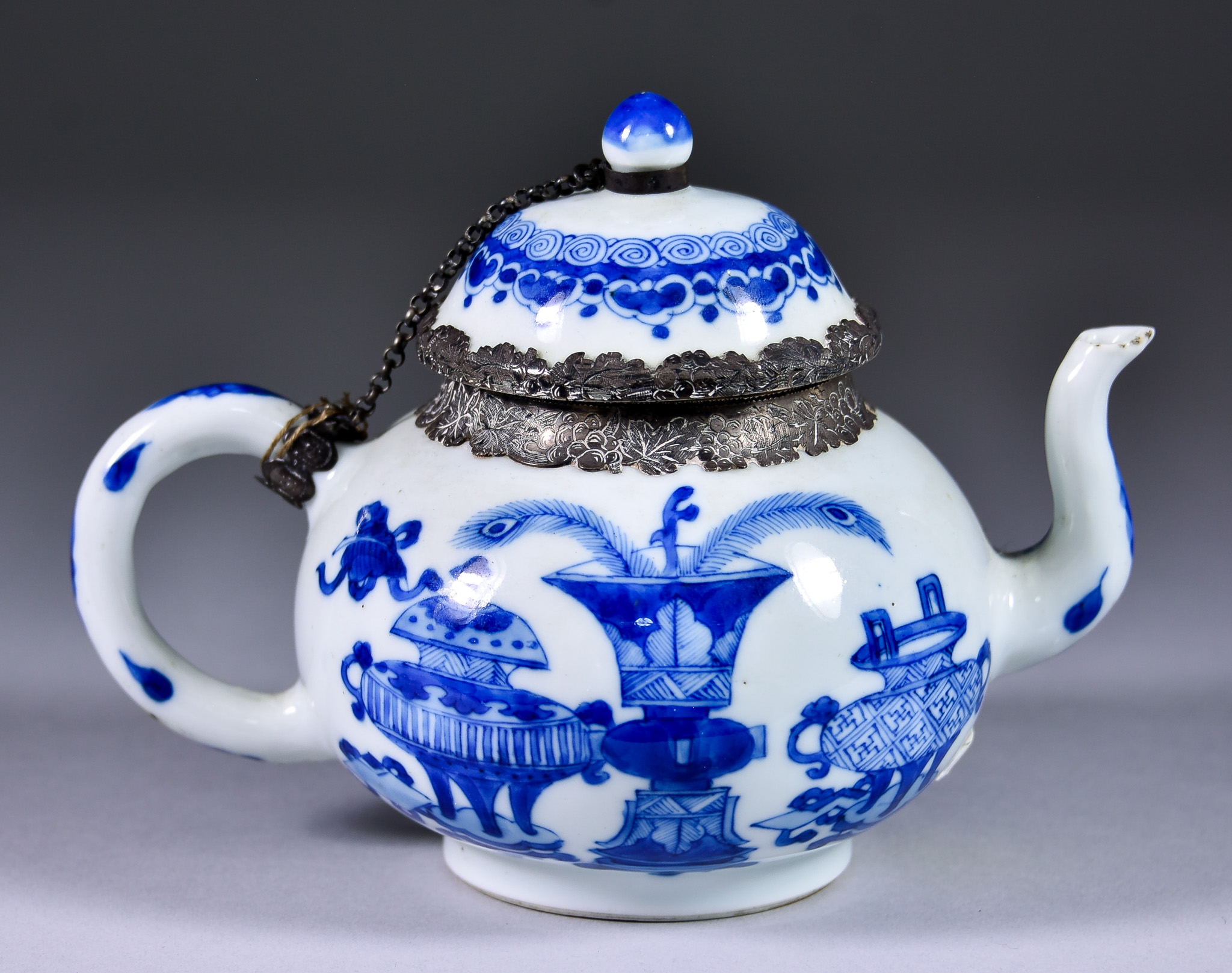 A Chinese Blue and White Porcelain Teapot, Kangxi Period, with Dutch Silver Mounts, painted with