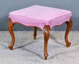 A Victorian Square Stool, the seat upholstered in purple cloth, on leaf capped and scroll cabriole