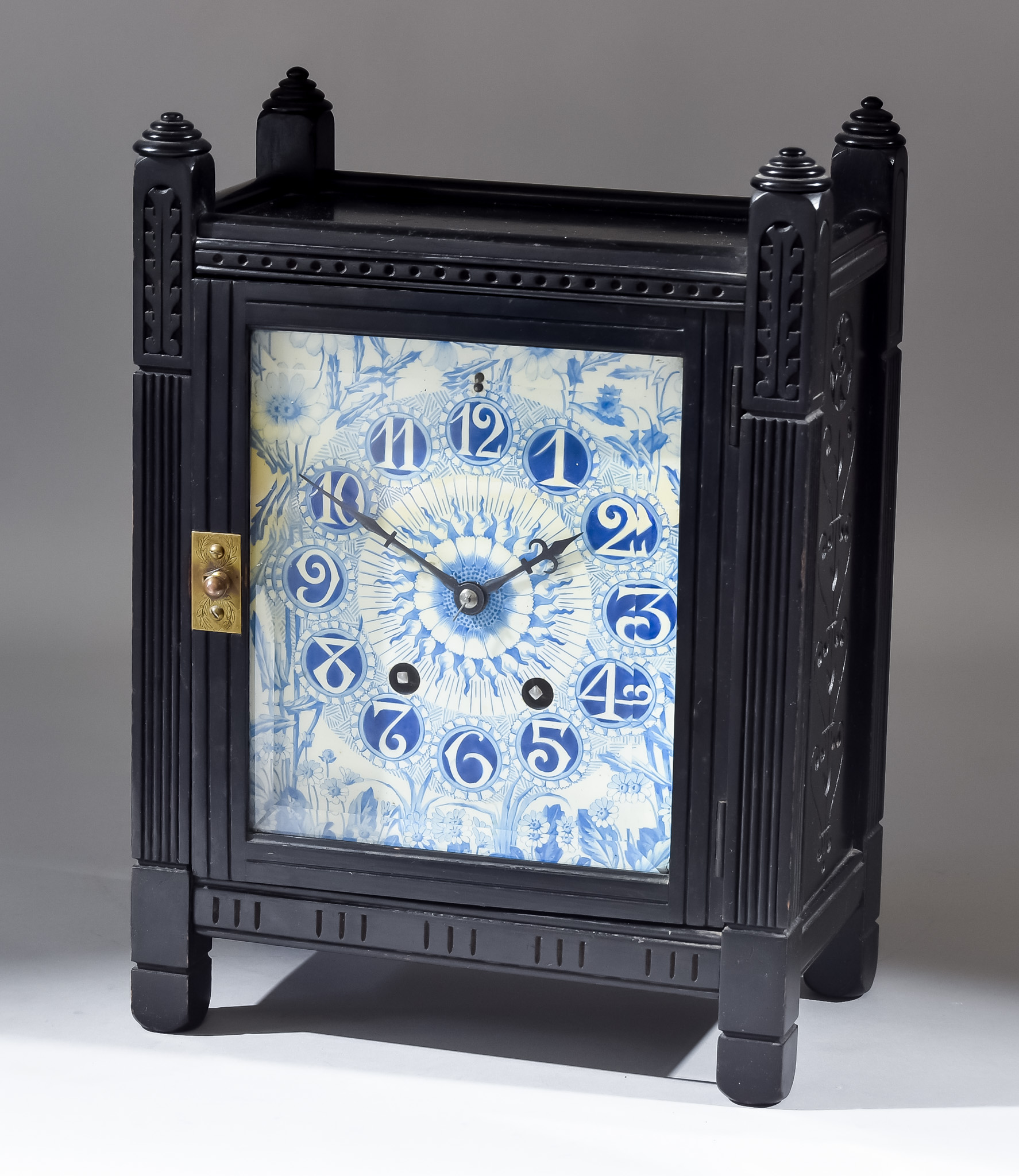 A 19th Century Aesthetic Movement Ebonised and Porcelain Inset Mantel Clock in the Manner of Lewis