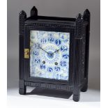 A 19th Century Aesthetic Movement Ebonised and Porcelain Inset Mantel Clock in the Manner of Lewis