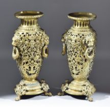 A Pair of Late 19th/ Early 20th Century Gilt Metal Urns, each pierced with scrolling foliate