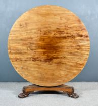 A George IV Figured Mahogany Circular Breakfast Table, on turned central column, triangular