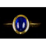 An 18ct Gold Modern Sapphire Ring, set with a cabochon sapphire, approximately 1ct, size M+, gross