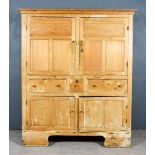 A Late 19th Century Panelled Pine Cupboard, with moulded edge to top, the upper part fitted one