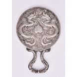 A Chinese Silvery Metal Backed Hand Mirror, chased and cast with dragons, cloud motifs, and heart