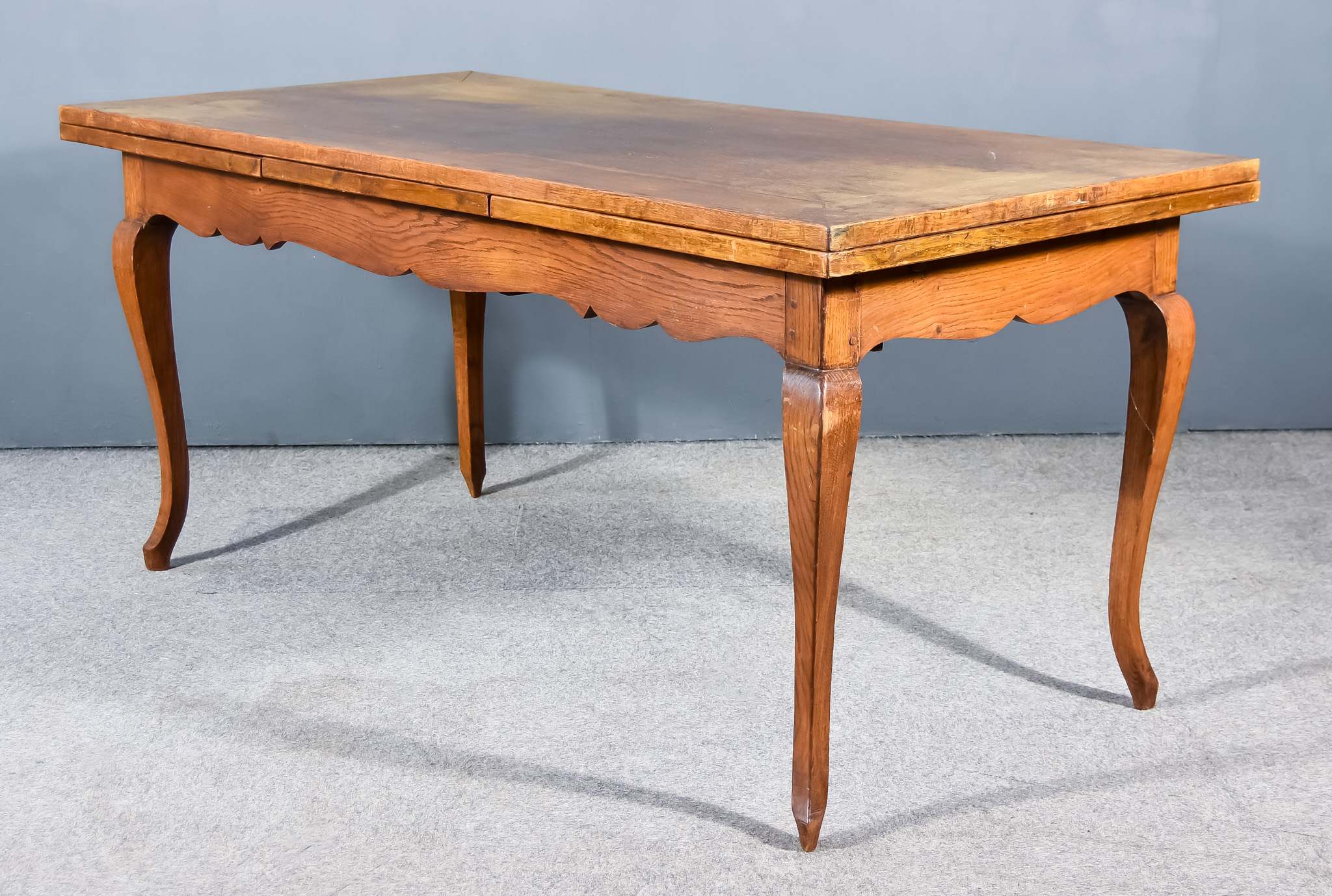 A 19th Century French Provincial Fruit Wood Drawer Leaf Kitchen Table, with square edge to top,