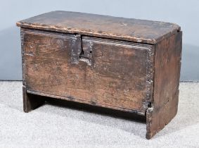 A 17th Century Oak Plank Coffer, with moulded edge to top, on shaped supports, 30.5ins wide x