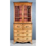 A George IV Figured Mahogany Secretaire Bookcase, the upper part with moulded cornice, fitted