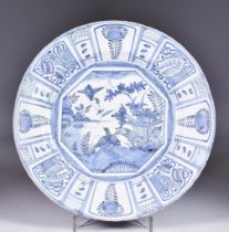 An English Delft Blue and White Charger painted in Kraak style, Early 18th Century, the central