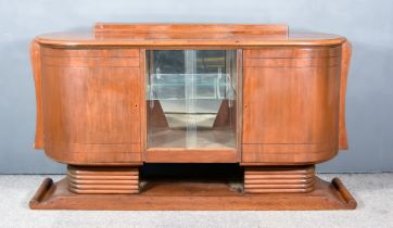An Early 20th Century Walnut Oval Side Cabinet of Art Deco Design, with moulded edge to top,
