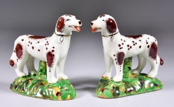 A Pair of Staffordshire Pottery Model Dogs, Early 20th Century, painted with brown markings and