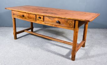 A 19th Century French Provincial Fruitwood Kitchen Table, with two plank cleated top, fitted three