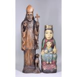 A 20th Century Oak Carving of a Bishop with lamb at foot, and holding a cross, 18ins overall, and