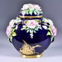 A Lynton Porcelain Flattened Ovoid Vase and Cover, by Stefan Nowacki, encrusted with roses,