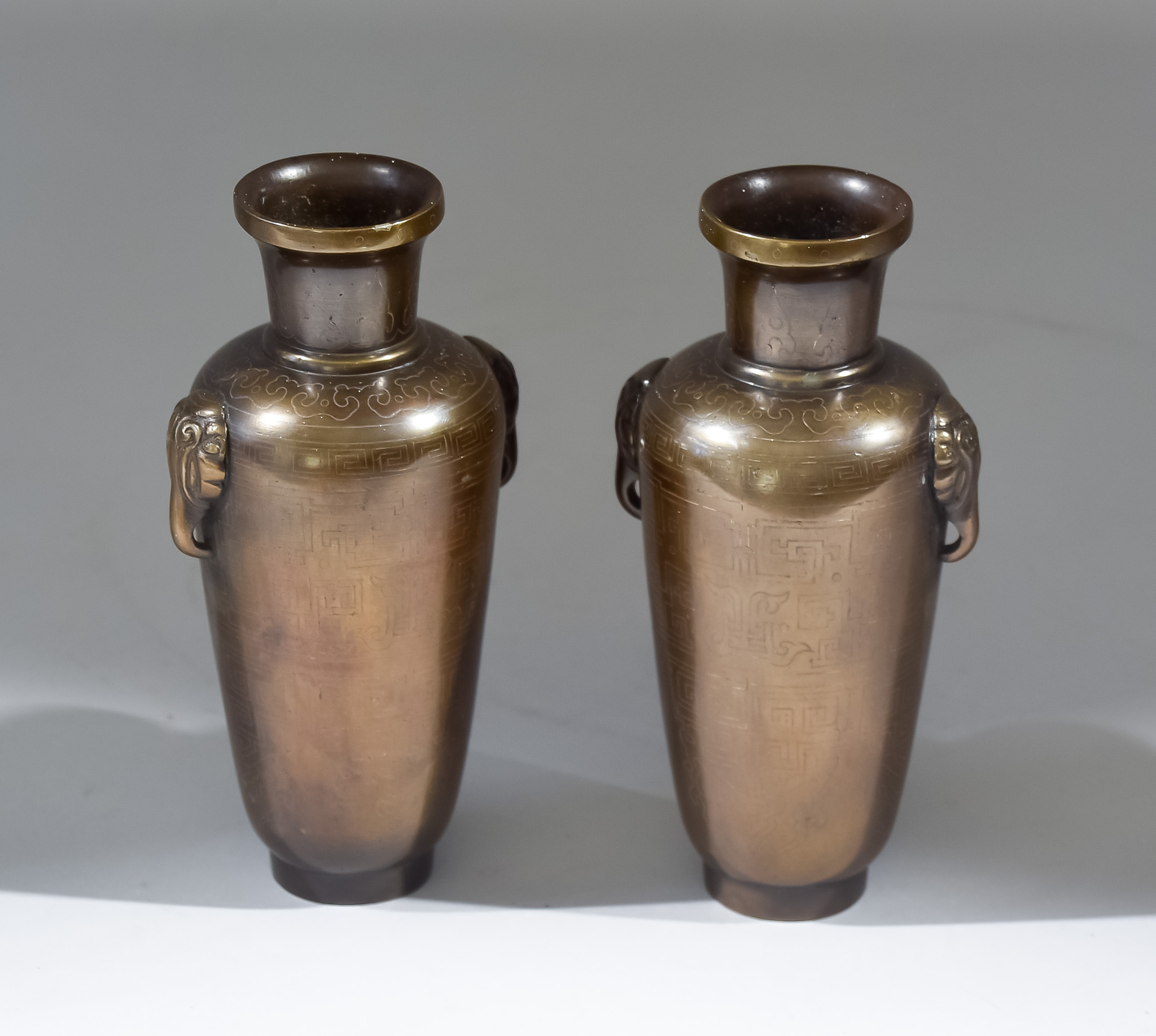 A Pair of Chinese Bronze Vases, decorated with silver wire inlay, 6ins high (15.25cm), each signed