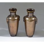 A Pair of Chinese Bronze Vases, decorated with silver wire inlay, 6ins high (15.25cm), each signed
