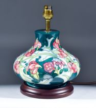 A Moorcroft Pottery Table Lamp, tube-lined and decorated with a flower design, and shade for same,