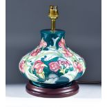 A Moorcroft Pottery Table Lamp, tube-lined and decorated with a flower design, and shade for same,