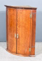 A George III Oak Corner Cupboard with moulded edge to top, dentil frieze, fitted three shelves