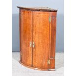 A George III Oak Corner Cupboard with moulded edge to top, dentil frieze, fitted three shelves