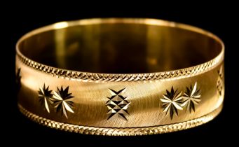 A Gold Bangle, 70mm diameter x 20mm, gross weight 44.1g Note: Metal unmarked but tests as 22ct