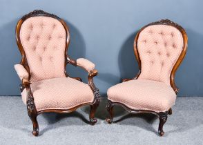 A Pair of Victorian Lady's and Gentleman's Walnut Framed Spoon Back Easy Chairs, with floral