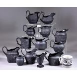 A Quantity of Black Basalt Jugs, 19th Century, various manufacturers and sizes and an early Wedgwood