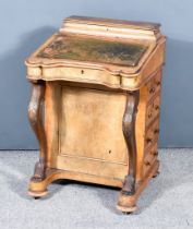 A Victorian Figured Walnut Davenport, with lidded superstructure, moulded edge and green and gilt